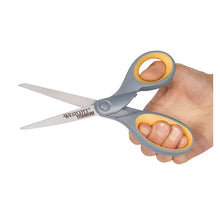 Titanium-bonded scissors with gray blades and orange/yellow grips held in hand