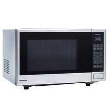 Stainless steel countertop microwave oven with side vent and keypad control panel