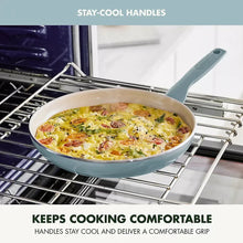 Light blue nonstick skillet on an oven rack with cooked food inside