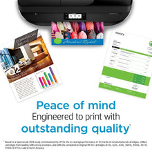 HP 950XL ink cartridge printouts with documents and invoices on a table
