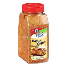 Bayou Cajun seasoning bottle with red cap, angled view, label centered