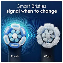 Toothbrush head with blue bristles showing fresh vs worn bristle tips