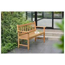 Outdoor wooden patio bench with slatted back, armrests, and flat seat plank.