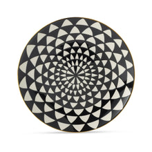 Black and white ceramic dinner plate with geometric medallion swirl pattern