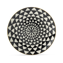 Black-and-white ceramic dinner plate with concentric triangle medallion design