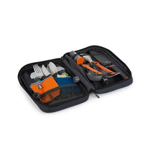 Camp kitchen utensil set in open black organizer with orange tool handles