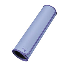 Rolled Logitech lilac desk mat with stitched edge and logi. logo