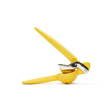 Yellow citrus juicer with hinged press and angled cone reamer