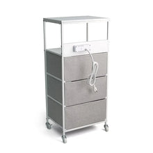 Three-drawer rolling cart showing built-in power outlets and charging cable