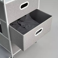 Gray felt drawer organizer with oval handle and open interior with dark fabric