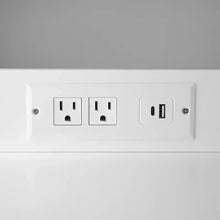 Built-in power strip with wall outlets and USB ports on white panel