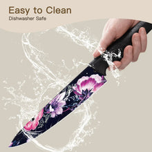 Kitchen knife with floral blade and black handle, water droplets shown on blade