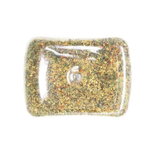 Garlic pepper seasoning in clear plastic tray, speckled yellow-gold spice blend.