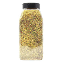 Garlic pepper seasoning bottle filled with speckled yellow-gold seasoning, black cap.
