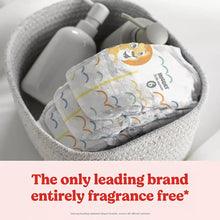 White Little Movers diapers with yellow lion pattern in gray bin
