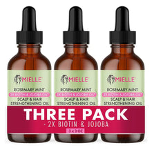 Three amber glass bottles of Mielle Rosemary Mint Scalp & Hair Strengthening Oil
