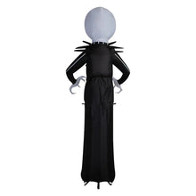 Giant Jack Skellington inflatable from behind, white head and black striped back