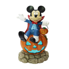 Mickey Mouse light-up vampire figure on glowing jack-o'-lantern with rocky base