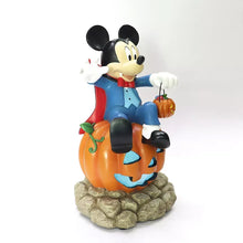 Mickey Mouse vampire light-up figure standing with pumpkin pail on rocky base
