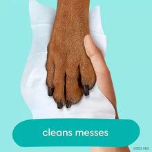 Hand holding baby wipe against another palm, cleans messes label