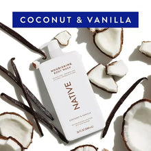 Nourishing body wash bottle with pump, coconut halves and vanilla pods
