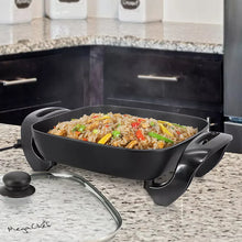 Electric skillet with glass lid and nonstick pan, black handles; cooked food inside