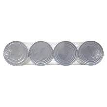 Four gray can lids grouped side by side, no labels visible