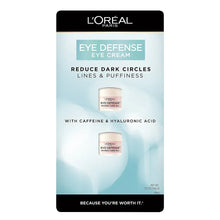 Eye defense eye cream box with dark top and blue label