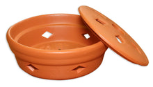 Orange terracotta mosquito coil burner with lid, vents, and coil compartment
