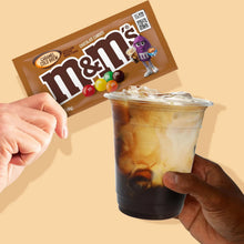 Caramel cold brew candy pack next to a cup of cold brew with caramel swirl and ice