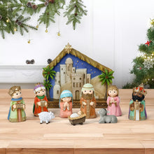 Resin miniature nativity set scene with stable, manger, sheep, and dressed characters