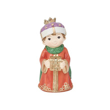 Resin miniature nativity figure of a king in purple headpiece and red robe, holding a gift