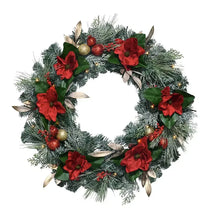 28-inch Christmas wreath with green pine, red magnolia-style flowers, and berries