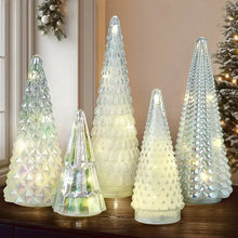 Glass Christmas tree set with LED lights, five faceted cone trees glowing in cool white tones