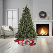 7.5 ft prelit Christmas tree with multicolor twinkle lights and decorated base