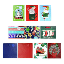 Assorted holiday gift bags with colorful prints and handles, including snowman and stocking