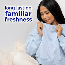 Light blue crewneck sweatshirt held by a person