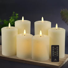 Wax pillar candles set with remote on wooden tray, multiple lit flames