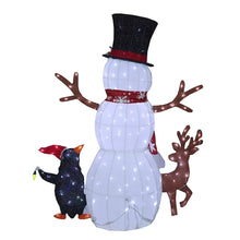 Pre-lit white fabric snowman with top hat and scarf, next to reindeer and penguin