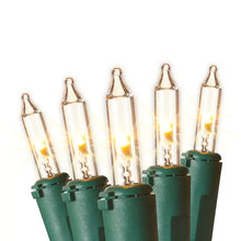 Soft white LED mini lights with green bases and clear bulbs, glowing.