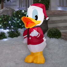 Inflatable Donald Duck in red Santa suit with hat and yellow boots