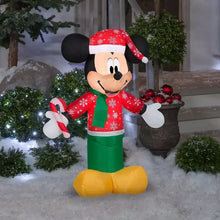 Inflatable Mickey Mouse figure in red snowflake jacket, green pants, Santa hat, candy cane