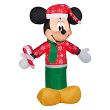 Inflatable Mickey Mouse figure facing forward with red patterned top, green pants, Santa hat
