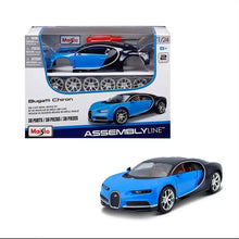 Blue die-cast sports car model with black roof and silver wheels