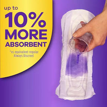 White Always Discreet Plus long adult incontinence pad held by a hand.