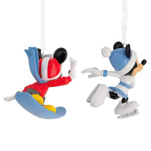 Two character ornament figures with hanging loops, side views of snowboarding and ice skating