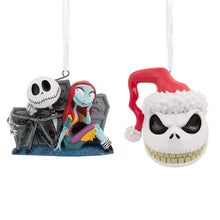 Set of 2 hanging Halloween head ornaments: white skull faces, red hood, blue base.