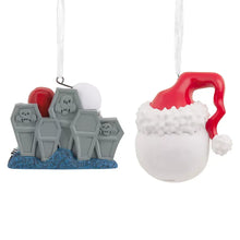 Set of 2 hanging Halloween ornaments: white skull heads, red hood, gray tomb figures.