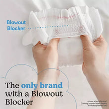 White diaper held with a highlighted blowout blocker section, hands pulling up waistband