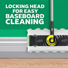 Swiffer mop head locked for baseboard cleaning with white scrubbing pad